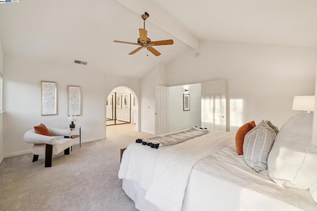 carpeted bedroom with lofted ceiling with beams and ceiling fan