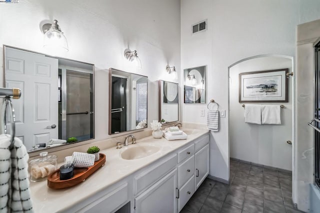 bathroom with vanity and tile patterned flooring