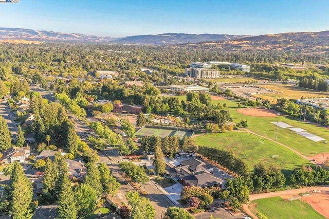 birds eye view of property with a mountain view