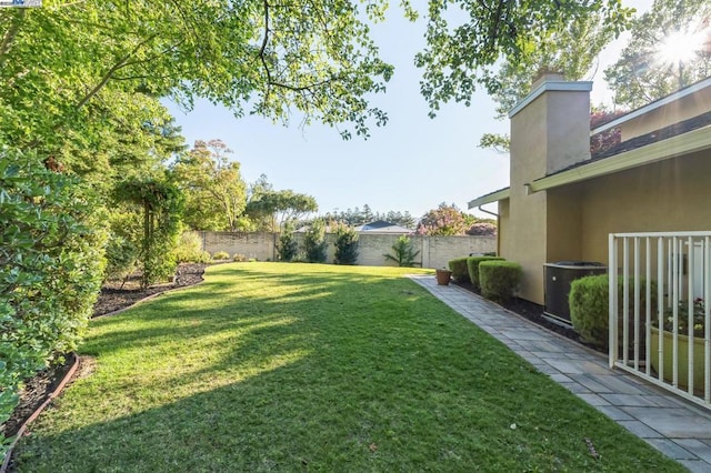 view of yard with central AC