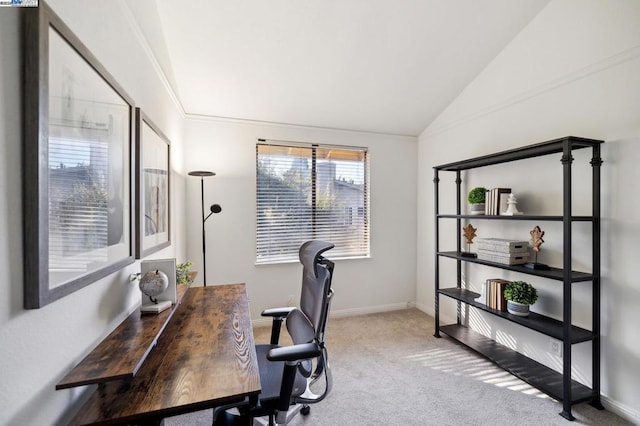 office area featuring lofted ceiling and light carpet