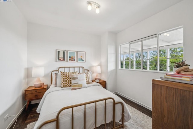 bedroom featuring dark hardwood / wood-style floors