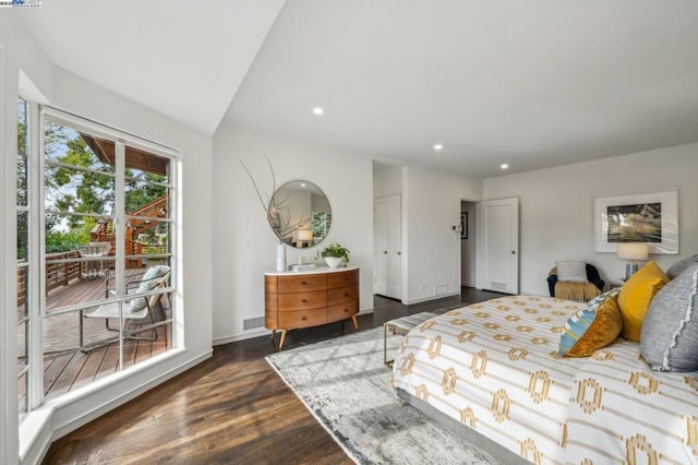 bedroom with dark wood-type flooring