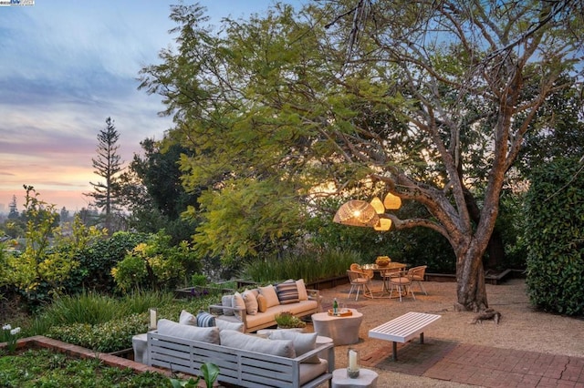 patio terrace at dusk with an outdoor living space