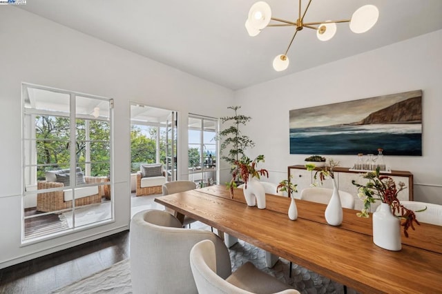 dining room featuring hardwood / wood-style floors and a notable chandelier