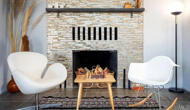 sitting room featuring dark tile patterned flooring