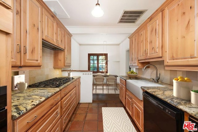 kitchen featuring decorative light fixtures, dishwasher, sink, stainless steel gas cooktop, and light stone counters