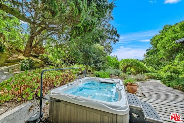 view of pool featuring a hot tub