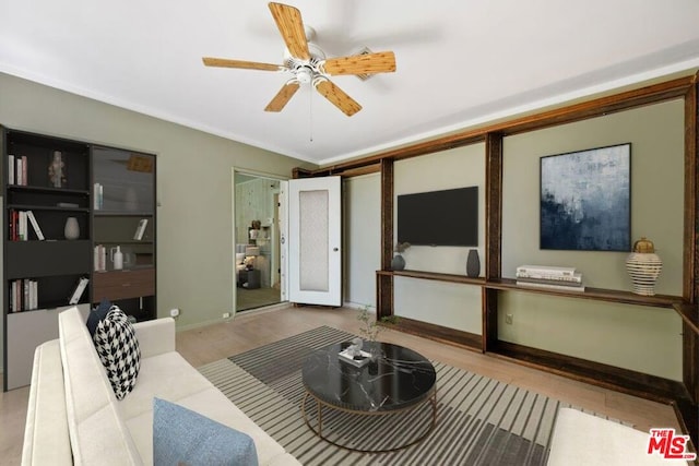 living room with light hardwood / wood-style floors and ceiling fan