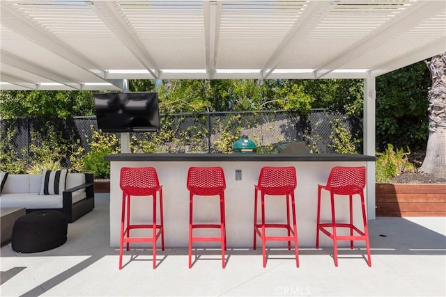 view of patio with an outdoor hangout area and an outdoor bar