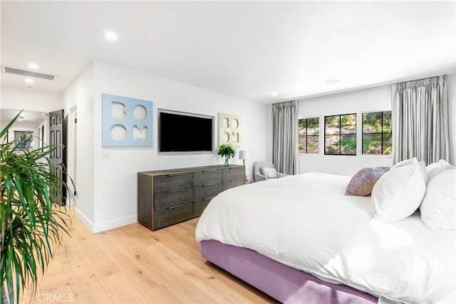 bedroom with light hardwood / wood-style flooring