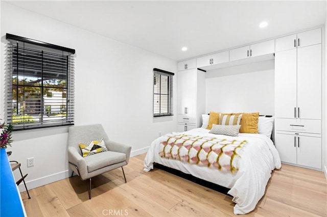 bedroom with light wood-type flooring