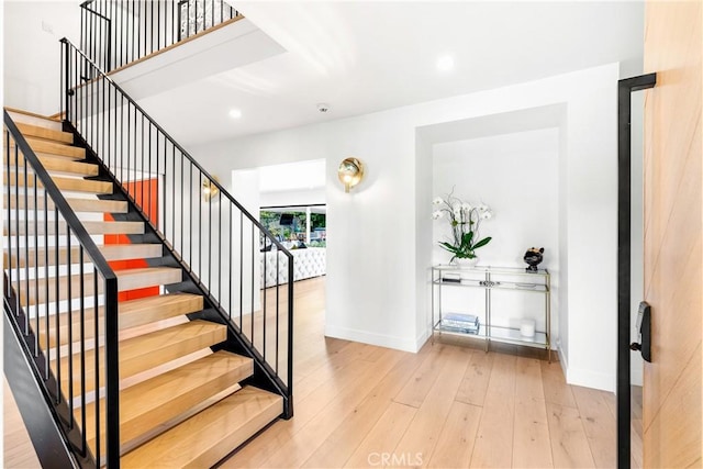 staircase featuring hardwood / wood-style flooring