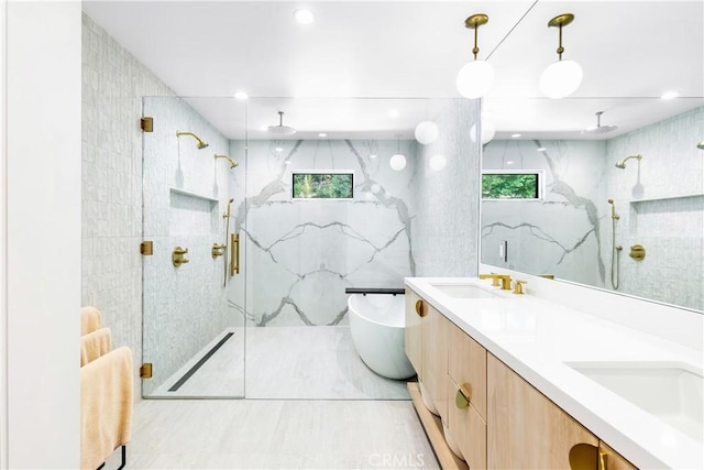 bathroom featuring vanity, tile walls, and an enclosed shower