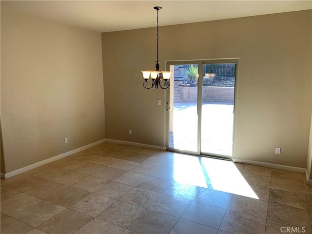 unfurnished room featuring a notable chandelier and light tile patterned floors