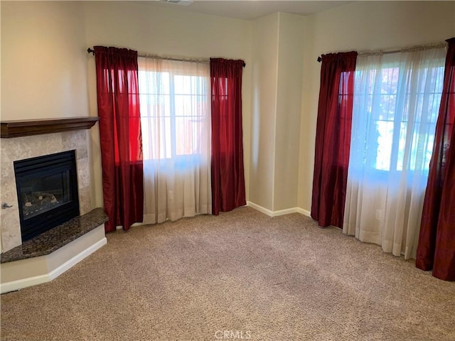 unfurnished living room featuring carpet floors