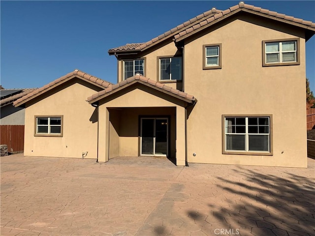 back of property featuring a patio