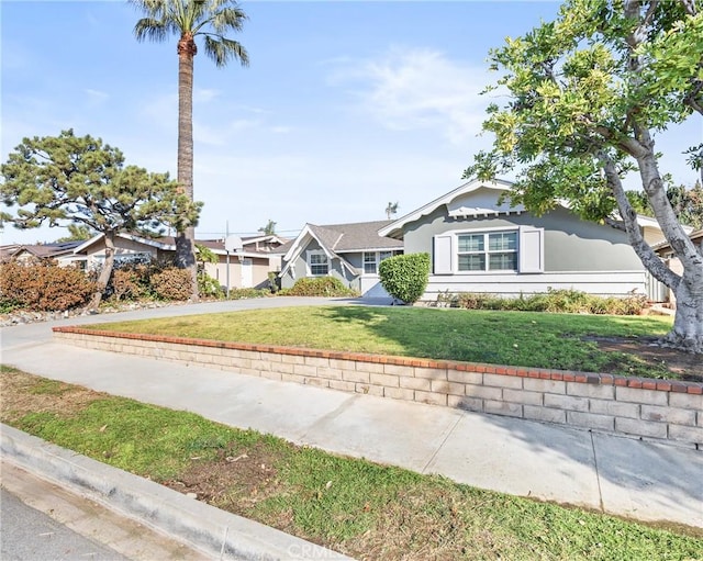 view of front of property with a front lawn