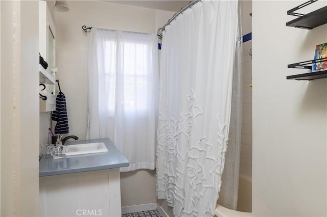 bathroom with vanity and shower / tub combo