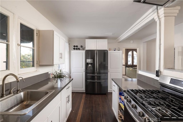 kitchen with sink, white cabinetry, gas stove, dark hardwood / wood-style flooring, and black fridge with ice dispenser