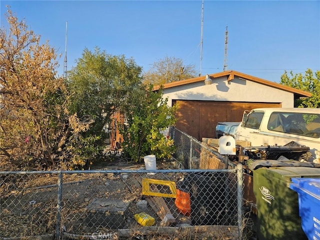 view of side of home with a garage