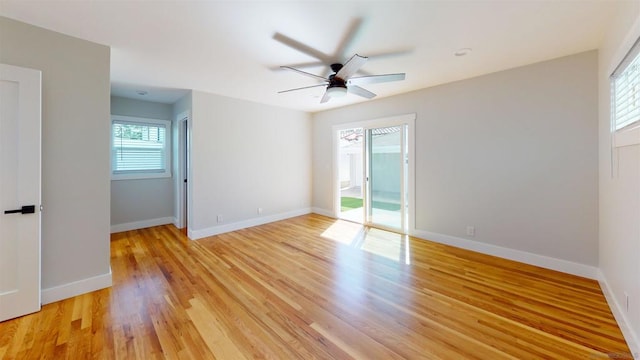 empty room featuring light hardwood / wood-style flooring and ceiling fan