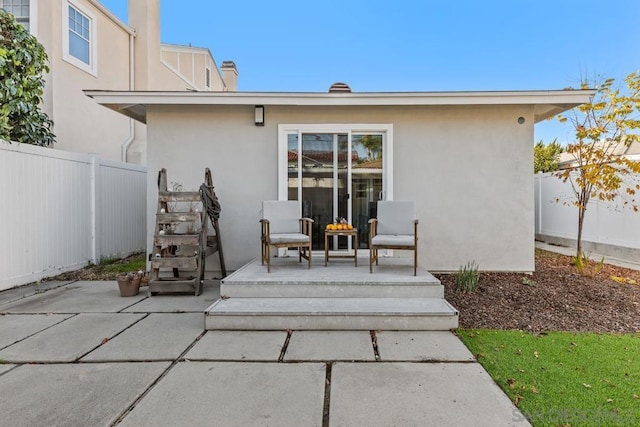 back of house with a patio area