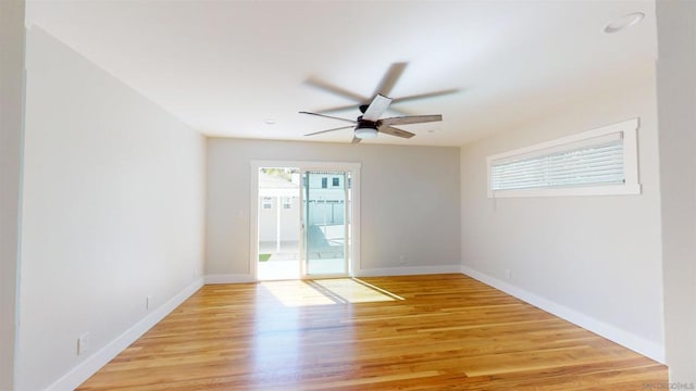 spare room featuring ceiling fan and light hardwood / wood-style floors