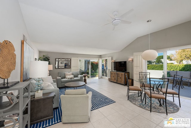 tiled living room with lofted ceiling and ceiling fan