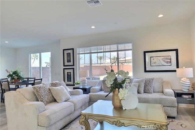 living room with light hardwood / wood-style flooring