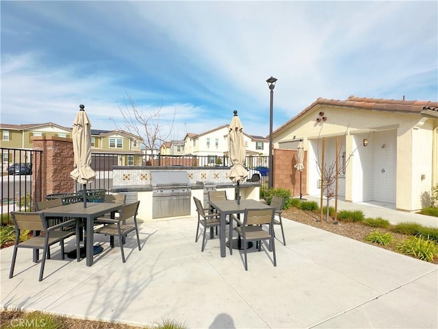 view of patio / terrace featuring area for grilling and a grill