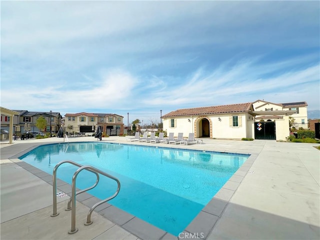 view of swimming pool featuring a patio area