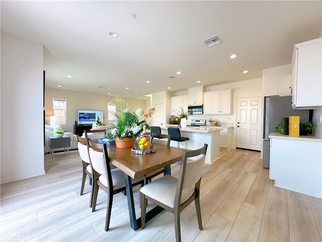 dining room featuring light hardwood / wood-style flooring