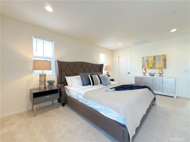 bedroom with light colored carpet