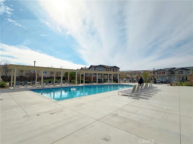 view of swimming pool featuring a patio area