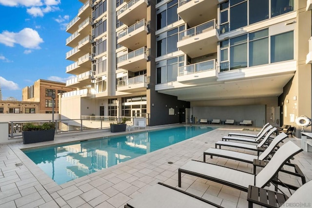 view of swimming pool featuring a patio area