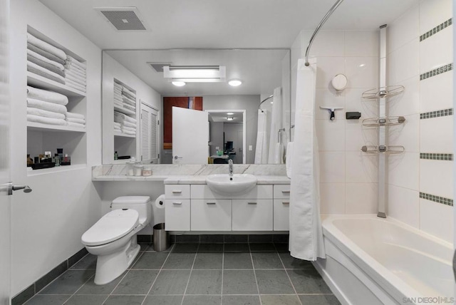 full bathroom featuring vanity, shower / bath combination with curtain, tile patterned floors, and toilet