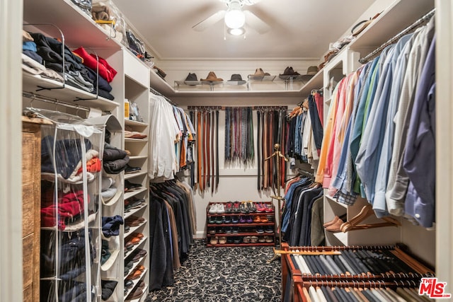 walk in closet with ceiling fan