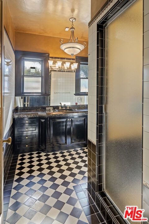 bathroom featuring vanity and a wealth of natural light