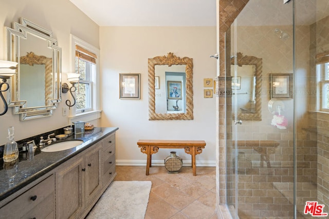 bathroom with vanity, tile patterned floors, and a shower with shower door