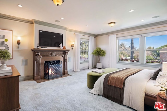 bedroom with crown molding and light carpet