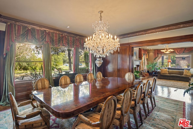 dining space featuring dark wood-type flooring and a chandelier