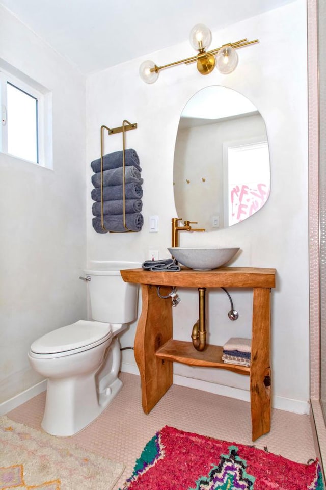 bathroom featuring sink and toilet