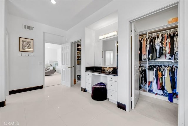 bathroom with vanity and tile patterned flooring