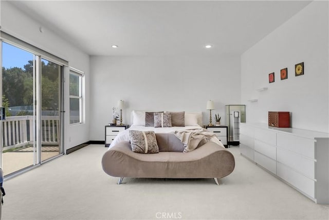 bedroom with light colored carpet and access to exterior