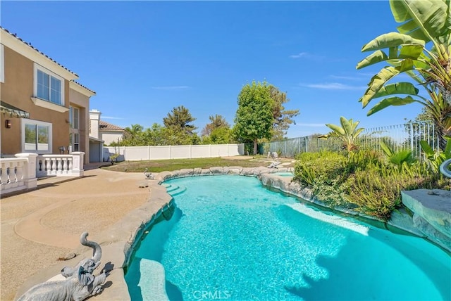 view of swimming pool featuring a patio area