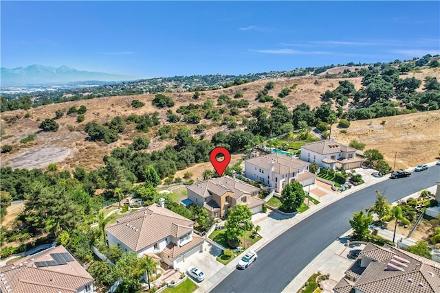 drone / aerial view featuring a mountain view