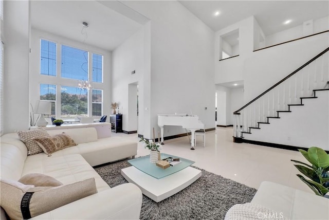 tiled living room with an inviting chandelier and a towering ceiling