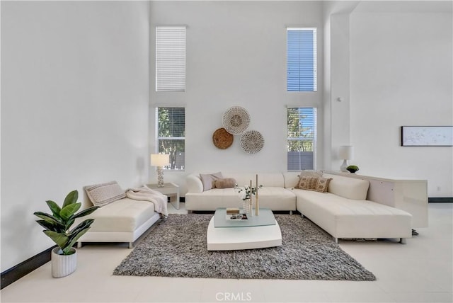 living room with a high ceiling