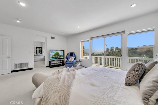 carpeted bedroom with access to outside